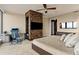 Serene bedroom featuring a desk area, stone-textured wall with TV and a plush bed at 3344 Peachtree Ne Rd # 3405, Atlanta, GA 30326