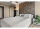 Bedroom with a king size bed and accent wall with built in wardrobe at 3344 Peachtree Ne Rd # 3405, Atlanta, GA 30326