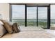 Cozy bedroom with a comfortable bed offering stunning views from large windows at 3344 Peachtree Ne Rd # 3405, Atlanta, GA 30326