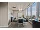 Elegant conference room with a large table, modern lighting, and city views through expansive windows at 3344 Peachtree Ne Rd # 3405, Atlanta, GA 30326