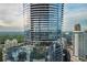 High-rise building showcasing modern glass architecture, exterior balconies and a rooftop terrace at 3344 Peachtree Ne Rd # 3405, Atlanta, GA 30326