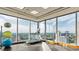 Bright workout room with a treadmill, exercise balls and a view of the city skyline through large windows at 3344 Peachtree Ne Rd # 3405, Atlanta, GA 30326