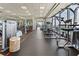 Well-equipped gym featuring weight machines and cardio equipment with floor-to-ceiling windows overlooking the city at 3344 Peachtree Ne Rd # 3405, Atlanta, GA 30326