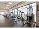 Bright, modern gym with state-of-the-art fitness equipment and expansive windows showcasing city views at 3344 Peachtree Ne Rd # 3405, Atlanta, GA 30326