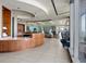 Modern gym reception area with wood accents, tile flooring and fitness equipment in the background at 3344 Peachtree Ne Rd # 3405, Atlanta, GA 30326