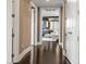 Hallway with dark wood flooring leads to a bright living space and neutral colored walls provide a contemporary backdrop at 3344 Peachtree Ne Rd # 3405, Atlanta, GA 30326
