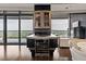 Modern kitchen island with wine fridge, bar cabinet, and stunning city views from floor-to-ceiling windows at 3344 Peachtree Ne Rd # 3405, Atlanta, GA 30326