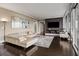 Bright living room with hardwood floors, a comfortable sofa, modern art, and access to an outdoor balcony at 3344 Peachtree Ne Rd # 3405, Atlanta, GA 30326