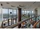 Modern building lobby with expansive windows and exterior views, hardwood floors, and unique ceiling design at 3344 Peachtree Ne Rd # 3405, Atlanta, GA 30326