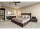 This main bedroom features a ceiling fan, a dresser, and neutral walls at 3344 Peachtree Ne Rd # 3405, Atlanta, GA 30326