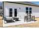 Cozy back patio with outdoor seating, perfect for enjoying the backyard view at 440 Madison Lakeview Dr, Acworth, GA 30102