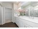 Bright bathroom with a double sink vanity, large mirror, and a glass-enclosed shower at 440 Madison Lakeview Dr, Acworth, GA 30102
