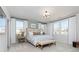 Serene bedroom featuring large windows, a comfortable bed, and stylish decor at 440 Madison Lakeview Dr, Acworth, GA 30102