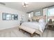 Comfortable bedroom featuring a queen-sized bed, a sitting bench, and natural light from large windows at 440 Madison Lakeview Dr, Acworth, GA 30102