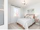 Bright bedroom with neutral decor, soft lighting, and a comfortable bed next to a window at 440 Madison Lakeview Dr, Acworth, GA 30102