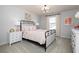 Cozy bedroom with a metal bed frame, neutral walls, and natural light from the window at 440 Madison Lakeview Dr, Acworth, GA 30102