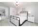 Bedroom with metal bed frame, carpet, and two bedside dressers with lamps at 440 Madison Lakeview Dr, Acworth, GA 30102