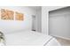 Simple bedroom featuring cozy interiors, carpeted floors, and a walk-in closet for ample storage at 440 Madison Lakeview Dr, Acworth, GA 30102