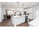 Bright, open-concept kitchen with a large island, stainless steel appliances, and pendant lighting at 440 Madison Lakeview Dr, Acworth, GA 30102