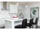 Stylish kitchen island with pendant lighting, white countertops, and barstools for casual dining at 440 Madison Lakeview Dr, Acworth, GA 30102