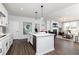 Modern kitchen with island that flows into an open living area, ideal for seamless entertaining at 440 Madison Lakeview Dr, Acworth, GA 30102