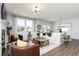 Bright, inviting living room featuring large windows and an adjacent dining area at 440 Madison Lakeview Dr, Acworth, GA 30102