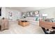 Spacious living room features stylish decor, a comfortable couch, and a foosball table at 440 Madison Lakeview Dr, Acworth, GA 30102