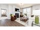 Inviting living room with a fireplace, comfortable seating, and natural light from large windows at 440 Madison Lakeview Dr, Acworth, GA 30102