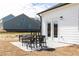 Outdoor patio features a table with stools and a view of neighboring homes at 440 Madison Lakeview Dr, Acworth, GA 30102