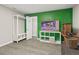 Open finished basement with modern floors, bright accent wall, and lots of space for entertaining and relaxing at 1645 Oakfield Ln, Roswell, GA 30075