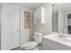 Bathroom with a new toilet, vanity, framed art, updated light fixtures, and walk-in shower at 1645 Oakfield Ln, Roswell, GA 30075