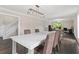 Elegant dining room with hardwood floors, modern lighting, and views into another living space at 1645 Oakfield Ln, Roswell, GA 30075