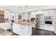 Bright kitchen with stainless steel appliances, white cabinets and a large center island with seating at 1645 Oakfield Ln, Roswell, GA 30075