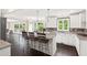 Open kitchen with white cabinets, granite countertops, and a stylish breakfast bar with seating at 1645 Oakfield Ln, Roswell, GA 30075