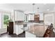 Open kitchen with white cabinets, granite countertops, and a stylish breakfast bar with seating at 1645 Oakfield Ln, Roswell, GA 30075