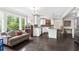 Open concept living room and kitchen with large windows offering an abundance of natural light at 1645 Oakfield Ln, Roswell, GA 30075