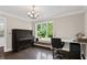 Bright home office with hardwood floors, a large window, piano, and a dedicated workspace at 1645 Oakfield Ln, Roswell, GA 30075
