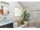 Bright bathroom featuring a soaking tub, glass shower and a vessel sink at 1652 Oak Grove Rd, Decatur, GA 30033