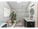 Bathroom featuring a soaking tub, glass shower, a vessel sink and a skylight at 1652 Oak Grove Rd, Decatur, GA 30033