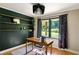 Inviting home office with floating shelves, natural light, a modern desk, and hardwood floors at 1652 Oak Grove Rd, Decatur, GA 30033