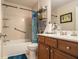 Neutral bathroom with a shower/tub combo, vanity and plenty of storage at 2294 Spicy Pine Ln, Lawrenceville, GA 30044