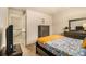 Comfortable bedroom with a patterned bedspread and coordinated furniture set at 2294 Spicy Pine Ln, Lawrenceville, GA 30044