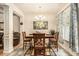 Charming dining area with stylish decor, natural light, and an adjacent living space at 2294 Spicy Pine Ln, Lawrenceville, GA 30044