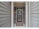 Charming front entrance with stone accents, decorative wreath, and a welcoming ambiance at 2294 Spicy Pine Ln, Lawrenceville, GA 30044