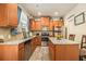 Well-equipped kitchen with wood cabinets, granite countertops, stainless appliances, and a central island at 2294 Spicy Pine Ln, Lawrenceville, GA 30044