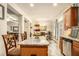Open concept kitchen and dining area with stainless steel appliances, granite island, and cozy breakfast nook at 2294 Spicy Pine Ln, Lawrenceville, GA 30044