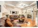 Elegant living room with coffered ceilings, hardwood floors, comfortable seating, and an open layout at 2294 Spicy Pine Ln, Lawrenceville, GA 30044
