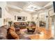Cozy living room showcasing hardwood floors, coffered ceilings and an open-concept layout at 2294 Spicy Pine Ln, Lawrenceville, GA 30044