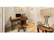 Cozy home office featuring a wooden desk, comfortable chair, and ample natural light at 2294 Spicy Pine Ln, Lawrenceville, GA 30044