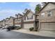 View of a row of well-maintained townhomes in a quiet neighborhood at 2294 Spicy Pine Ln, Lawrenceville, GA 30044